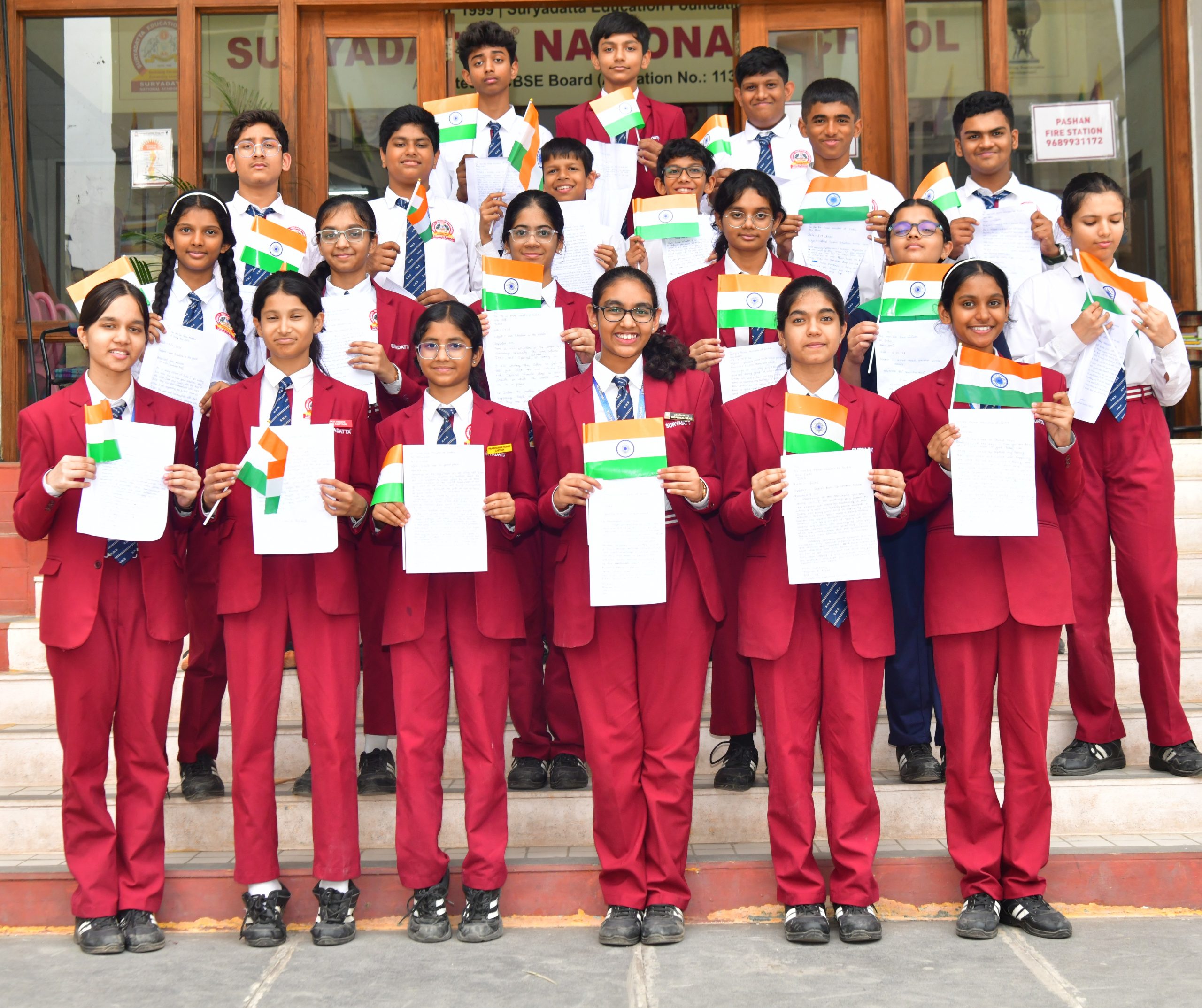 Students with flag and letter 1 new