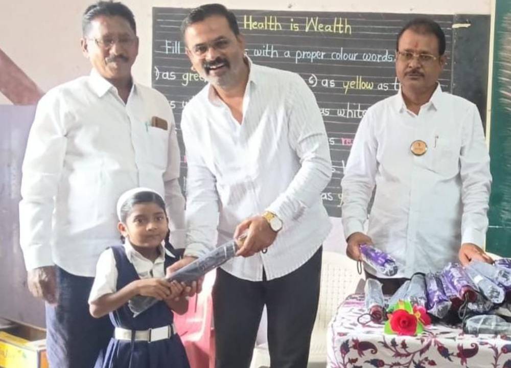 Suryadatta Distributes Umbrellas to School Students